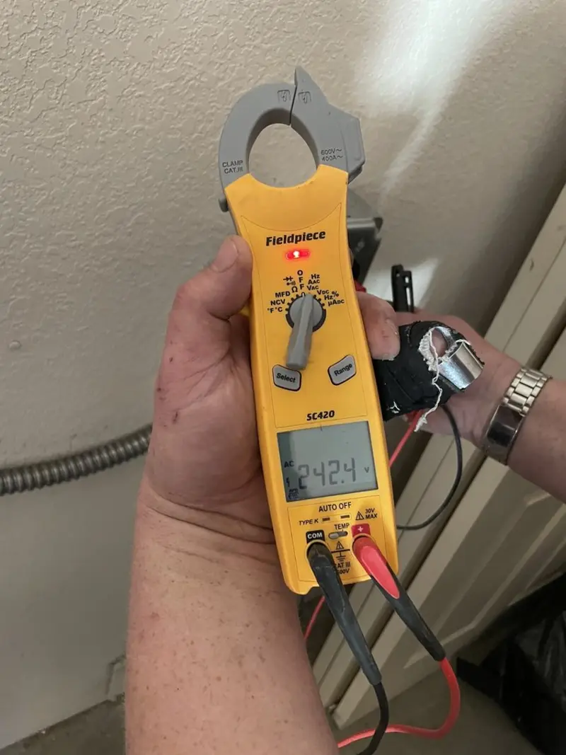 Voltage testing with clamp meter during Ceiling Fan Installation in Midland Park